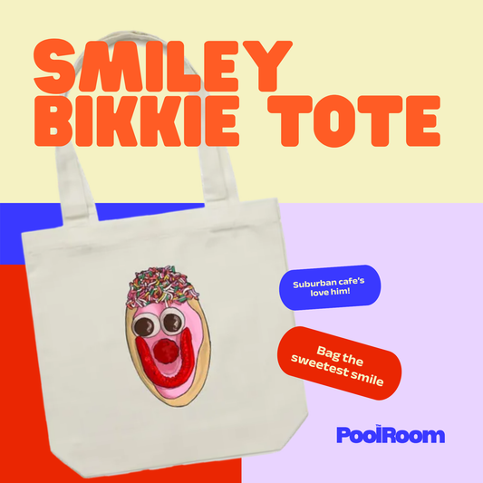 Cream cotton tote bag featuring a hand-drawn illustration of an Australian pink-iced Smiley Bikkie by The Pool Room.
Text reads: Smiley bikkie tote. Bag the sweetest smilie. Suburban cafe's love him!.